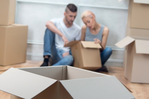 Crew moving office furniture through a commercial building