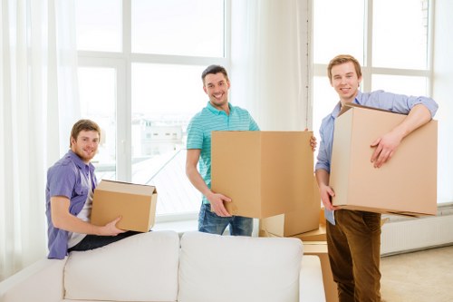Apartment moving preparation with boxes, labels, and protective packing materials