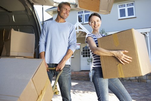 Man and van loading furniture and boxes for local transit