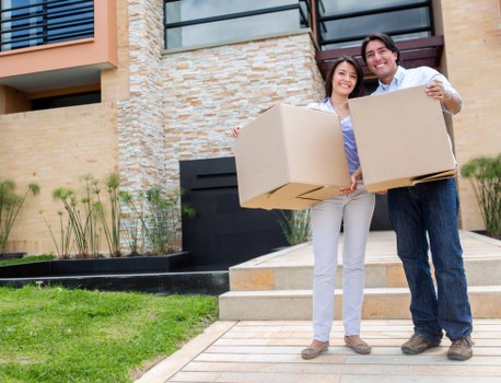 Loading household items into a van for a Waterloo move